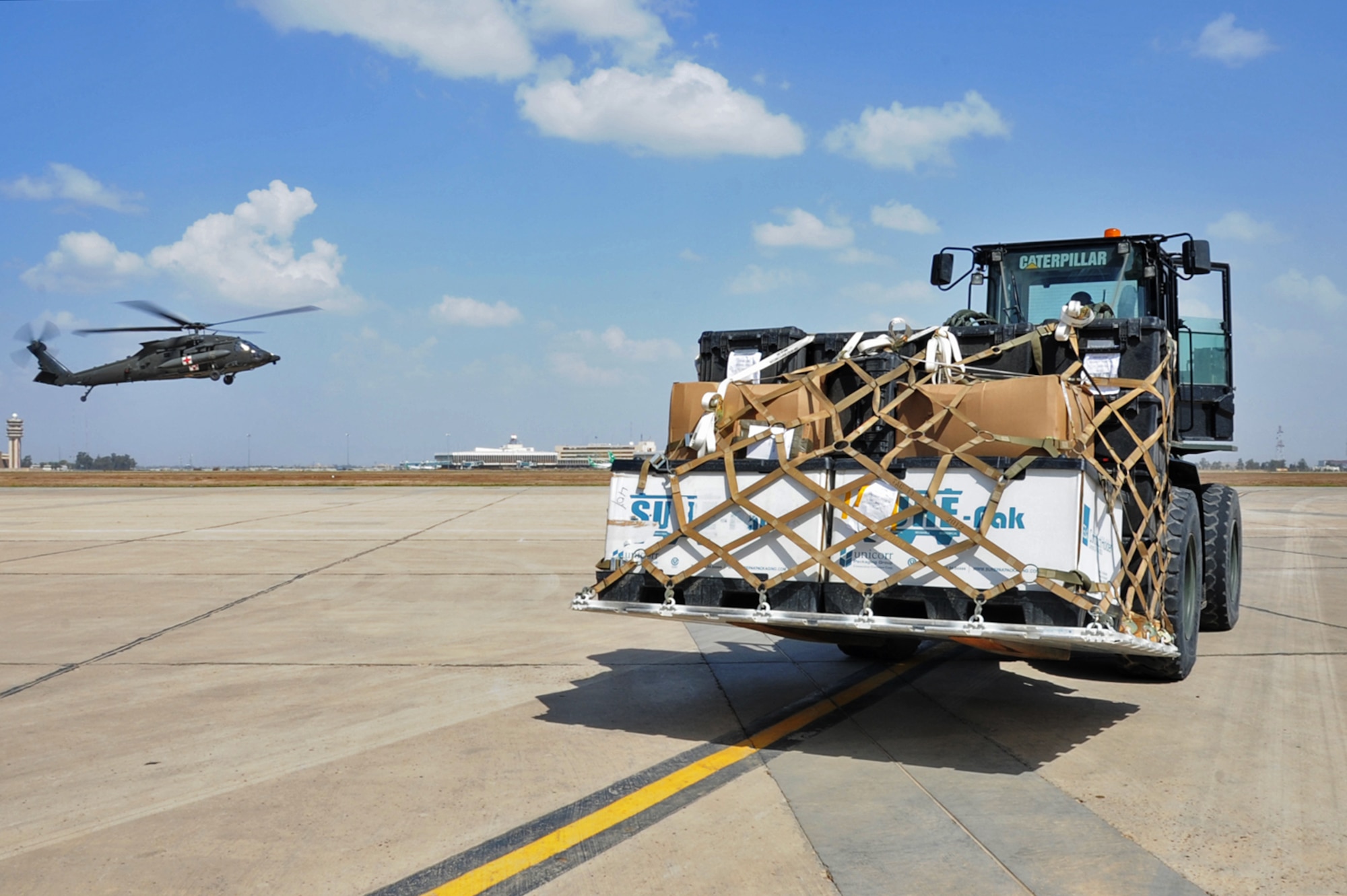 Airman 1st Class Carlos Tubbs, a 442nd Air Expeditionary Squadron aircraft services specialist, unloads a pallet of cargo off of a Marine C-130 March 21, 2017, at the Baghdad Diplomatic Support Center, Iraq.  Tubbs loads and unloads cargo supporting Combined Joint Task Force – Operation Inherent Resolve missions. (U.S. Air Force photo/Tech. Sgt. Kenneth McCann)