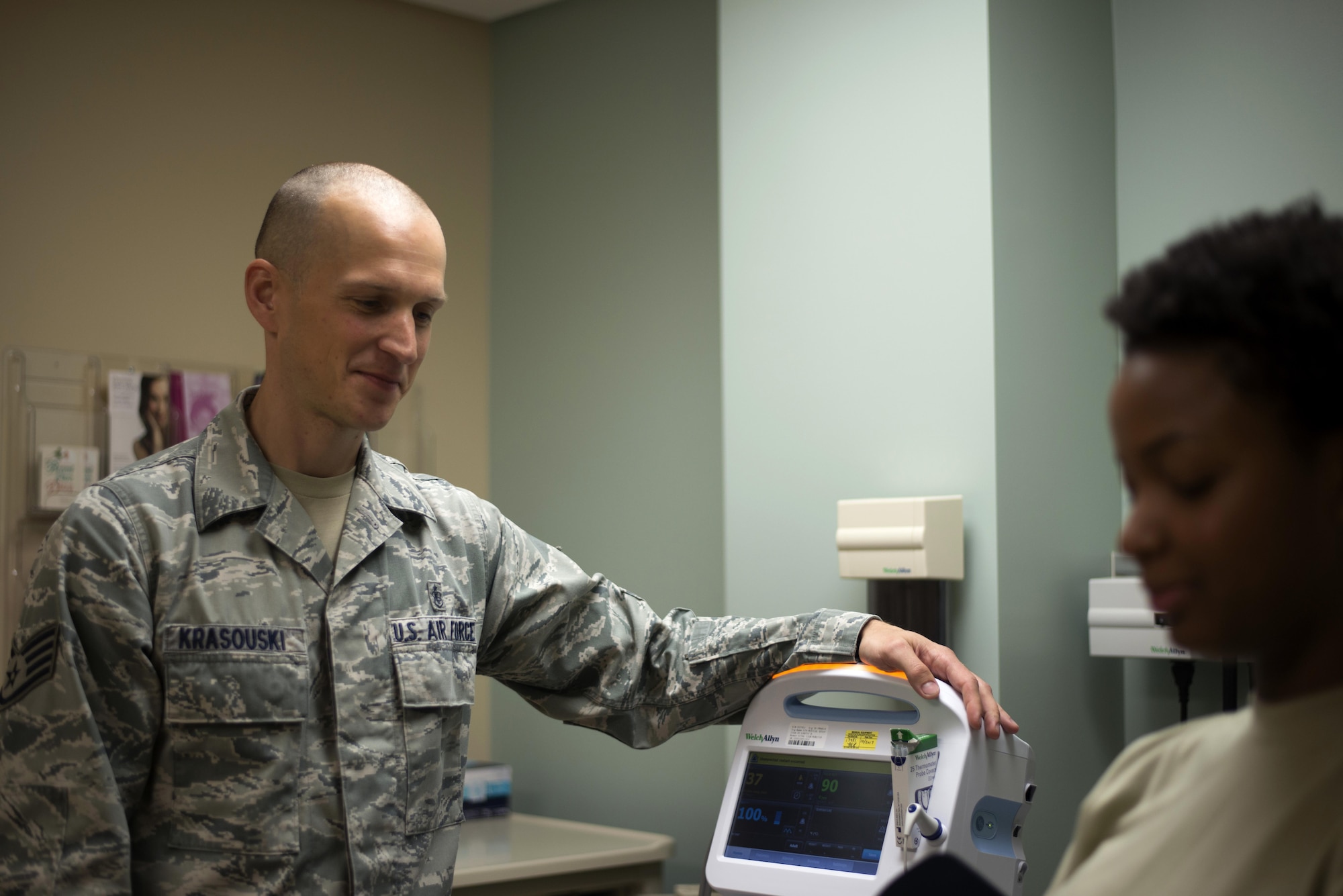 U.S. Air Force Staff Sgt. Aliaksei Krasouski, a medical technician assigned to the 91st Air Refueling Squadron, prepares to check the vitals of a patient March 8, 2017, at MacDill Air Force Base, Fla. Krasouski served in the Belarussian Air Force before coming to the U.S. 10 years ago. (U.S. Air Force Photo by Airman 1st Class Rito Smith) 