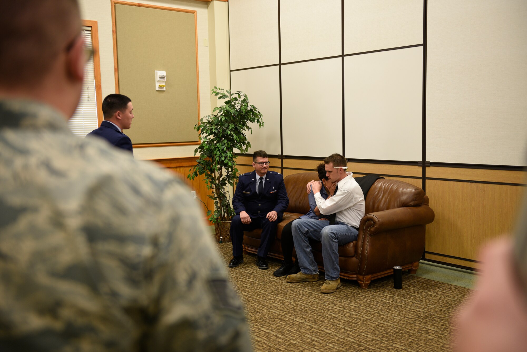 Senior Airman Annastasia Bostic, mother of the victim, is consoled by Tech. Sgt. Dustin Haldane, father of victim, after Chaplin (Capt.) William McMullen notifies the acting parents of the death of their daughter April 12, 2017, at the Grizzly Bend at Malmstrom Air Force Base, Mont. The event was part of “Live or Die,” a production helping members think about consequences before they get behind the wheel intoxicated. (U.S. Air Force photo\ Staff Sgt. Lindsey Soulsby)