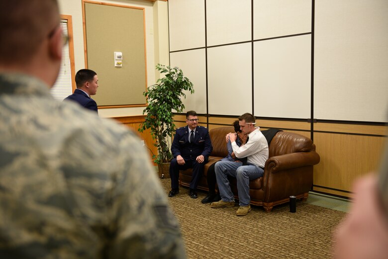 Senior Airman Annastasia Bostic, mother of the victim, is consoled by Tech. Sgt. Dustin Haldane, father of victim, after Chaplin (Capt.) William McMullen notifies the acting parents of the death of their daughter April 12, 2017, at the Grizzly Bend at Malmstrom Air Force Base, Mont. The event was part of “Live or Die,” a production helping members think about consequences before they get behind the wheel intoxicated. (U.S. Air Force photo\ Staff Sgt. Lindsey Soulsby)