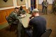 341st Security Forces members, Staff Sgt. Quentin V. Humphries and Airman 1st Class Jordan Bush in-process Staff Sgt. Jake Wiesen, acting perpetrator, April 12, 2017, at the Grizzly Bend at Malmstrom Air Force Base, Mont. The event was part of “Live or Die,” a production helping members think about consequences before they get behind the wheel intoxicated. (U.S. Air Force photo\ Staff Sgt. Lindsey Soulsby)