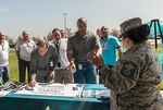 Master Sgt Maggie Ladd welcomes particpants supporting survivors of sexual assault at the Walk a Lap - Going the Distance event on Apr. 12.