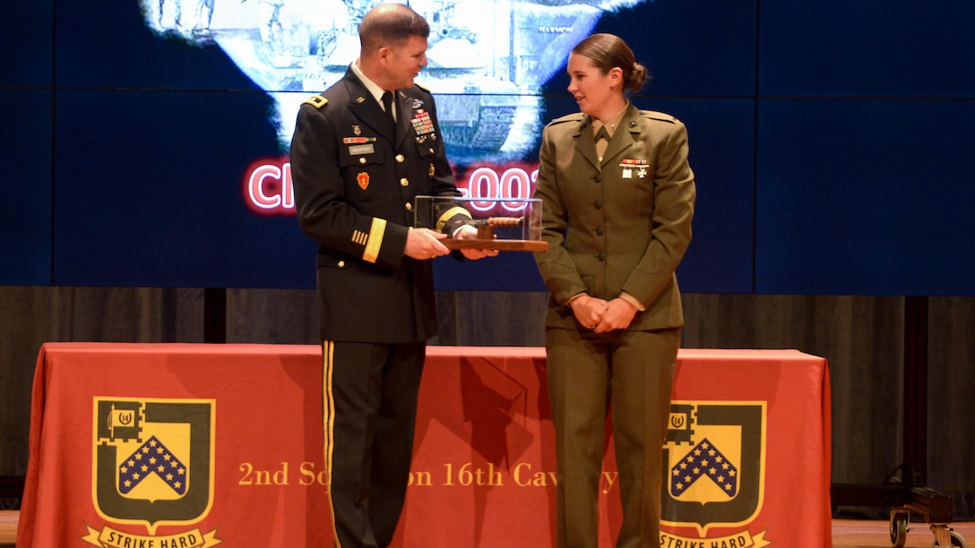 . Second lieutenant Polatchek presents an instructor with a graduation gift during the Army’s Armor Basic Officer Leaders Course at Fort Benning, Georgia, April 12, 2017. Polatchek graduated at the top of her class and is now the first female Tank Officer in the Marine Corps.