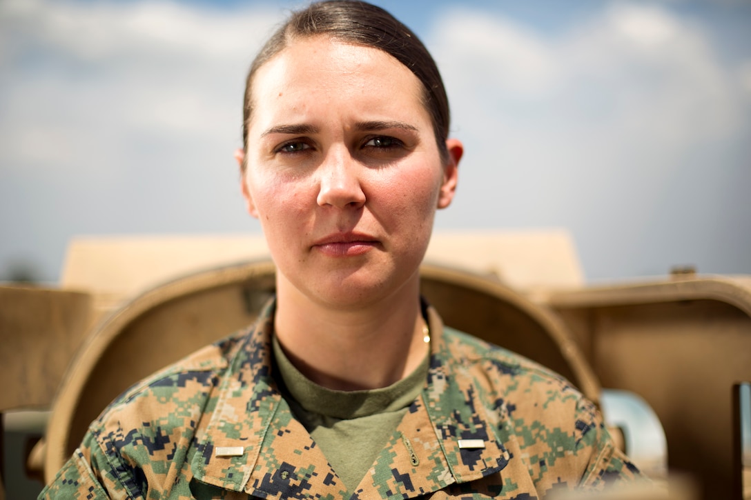 Second lieutenant Lillian Polatchek poses in front of an M1A1 Abrams tank at Fort Benning, Georgia. Polatchek is the first female Marine Tank Officer after graduating as the distinguished honor graduate of her Army’s Armor Basic Officer Leaders Course on April 12, 2017.