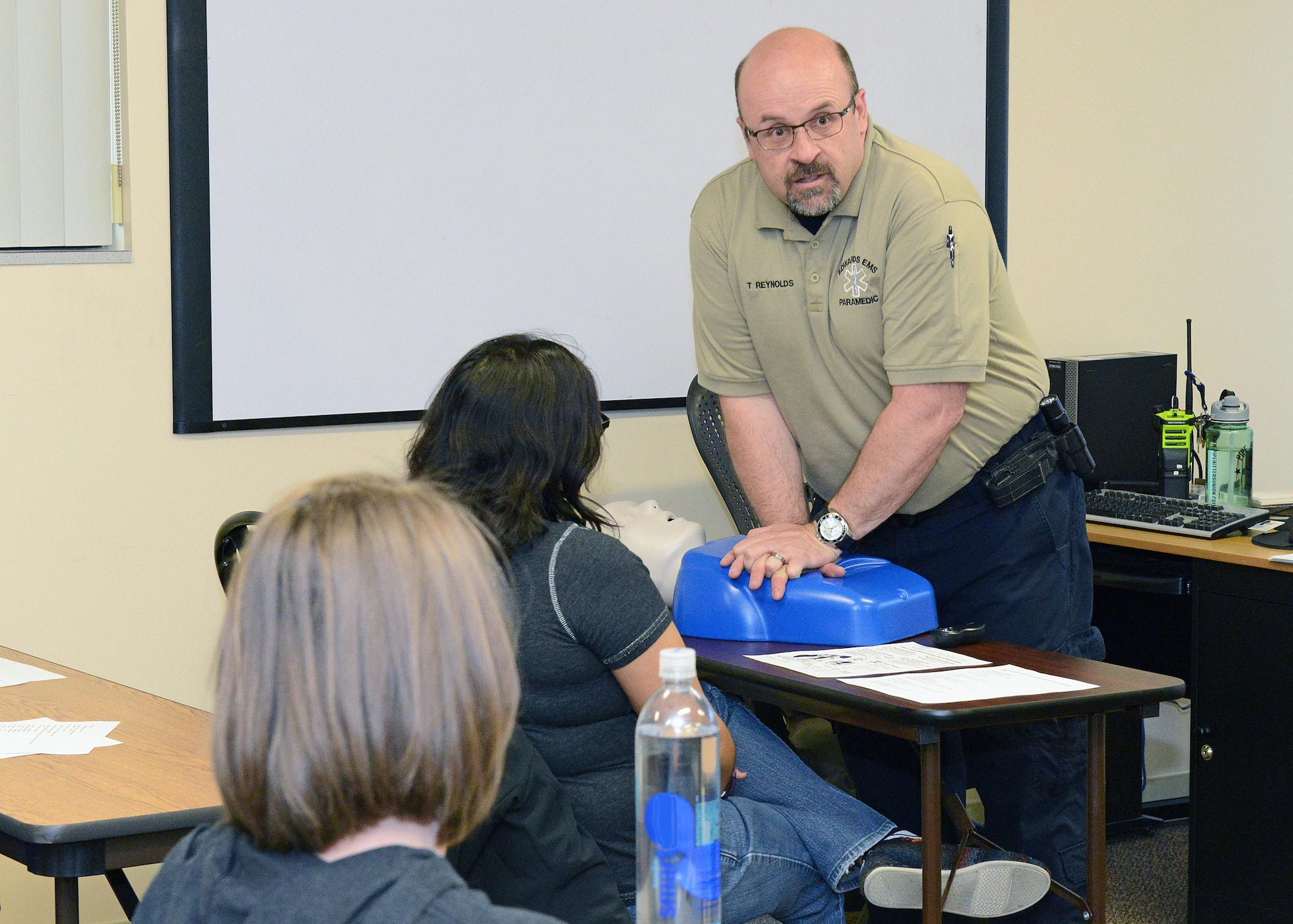 Timothy Reynolds, 412th Medical Operations Squadron medical technician, demonstrates CPR to a class attended by base spouses April 7. The 412th MDOS held three classes during the week at the 412th Medical Group Education and Training building. (U.S. Air Force photo by Kenji Thuloweit)