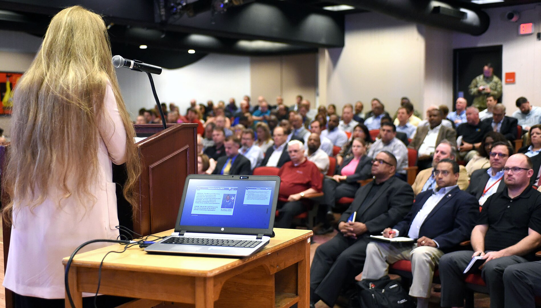 Deborah Word speaks to representatives from small and large industry during a Mission and Installation Contracting Command acquisition forecast open house March 29 at the Fayetteville Technical Community College in Fayetteville, N.C. Word is the MICC small business specialist for the MICC at nearby Fort Bragg, N.C.