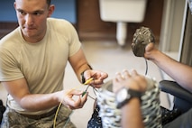Senior Airman Benjamin Vetter, 49th Civil Engineer Squadron explosive ordnance disposal technician performs electronic diagnostics on a hostage improvised explosive device to disarm it during training at Holloman Air Force Base, N.M. Apr. 7, 2017. The 49th CES EOD flight hosted an advanced electronics diagnostic course with EOD Airmen from Misawa Air Force Base, Japan and Cannon Air Force Base N.M. This training taught EOD Airmen about today's up and coming electronics technology and how these technologies can be incorporated by bomb makers.  During the course, students learned advanced electronic circuitry and how to analyze and interpret how it functions the IED in order to safely disarm a bomb. (U.S. Air Force photo by Staff Sgt. Stacy Jonsgaard)