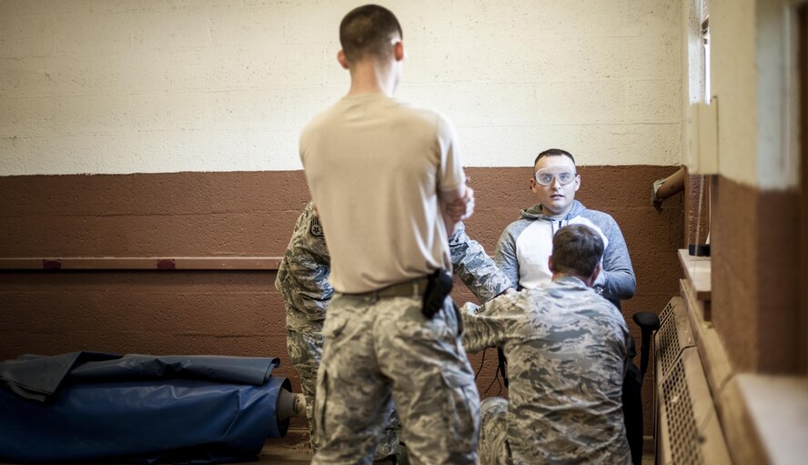 49th Civil Engineer Squadron explosive ordnance disposal team simulates a hostage situation during training at Holloman Air Force Base N.M. Apr. 7, 2017. The 49th CES EOD flight hosted an advanced electronics diagnostic course with EOD Airmen from Misawa Air Force Base, Japan and Cannon Air Force Base N.M. This training taught EOD Airmen about today's up and coming electronics technology and how these technologies can be incorporated by bomb makers.  During the course, students learned advanced electronic circuitry and how to analyze and interpret how it functions the IED in order to safely disarm a bomb. (U.S. Air Force photo by Staff Sgt. Stacy Jonsgaard)