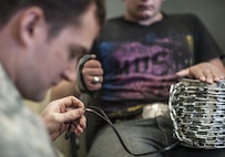 Staff Sgt. Justin Balkun with the 27th Civil Engineer Squadron explosive ordnance disposal technician performs electronic diagnostics on a hostage improvised explosive device to disarm it during training at Holloman Air Force Base N.M. Apr. 7, 2017. The 49th Civil Engineer Squadron EOD flight hosted an advanced electronics diagnostic course with EOD Airmen from Misawa Air Force Base, Japan and Cannon Air Force Base, N.M. This training taught EOD Airmen about today's up and coming electronics technology and how these technologies can be incorporated by bomb makers.  During the course, students learned advanced electronic circuitry and how to analyze and interpret how it functions the IED in order to safely disarm a bomb. (U.S. Air Force photo by Staff Sgt. Stacy Jonsgaard)