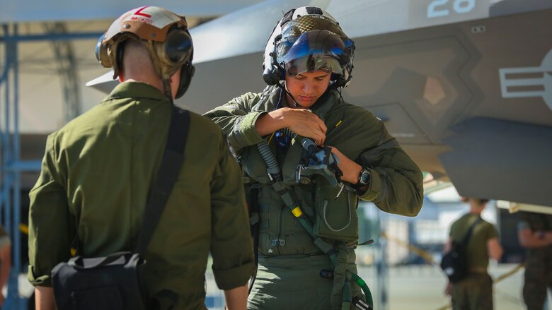 Maj. Jesse Peppers prepares his flight gear aboard Marine Corps Air Station Beaufort, April 11. Peppers and the other F-35B Lightning II pilot instructors are training with Joint Direct Attack
Munitions. After the instructors are proficient with JDAM they will add the ordnance to the syllabus for the F-35B training pilot program. Peppers is with Marine Fighter Attack Training Squadron 501, Marine Aircraft Group 31.