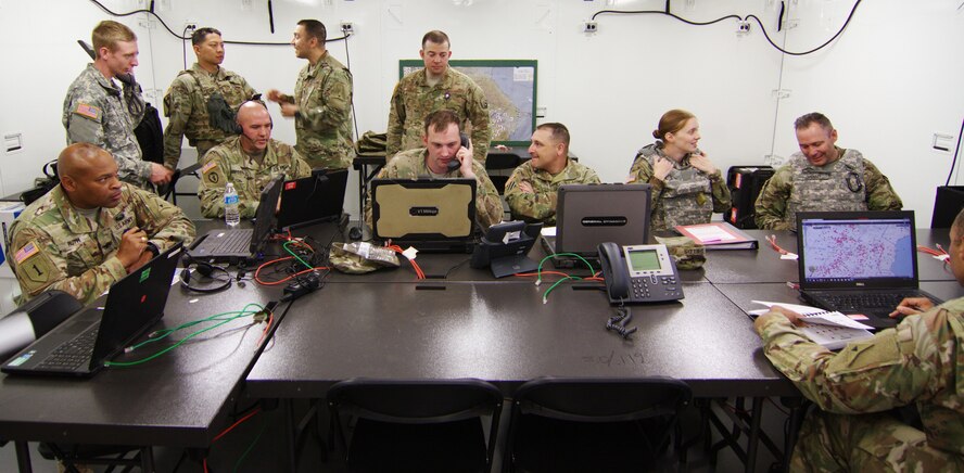 U.S. Airmen and Soldiers work together in the command post during Warfighter Exercise 17-4 at Fort Hood, Texas, April 5, 2017. WFX 17-4 ensured participants learned Joint Task Force headquarters functions, processes and authorities in preparation for deployment to Combined JTF-Operation Inherent Resolve headquarters. (U.S. Army photo by Staff Sgt. Matthew Alford)