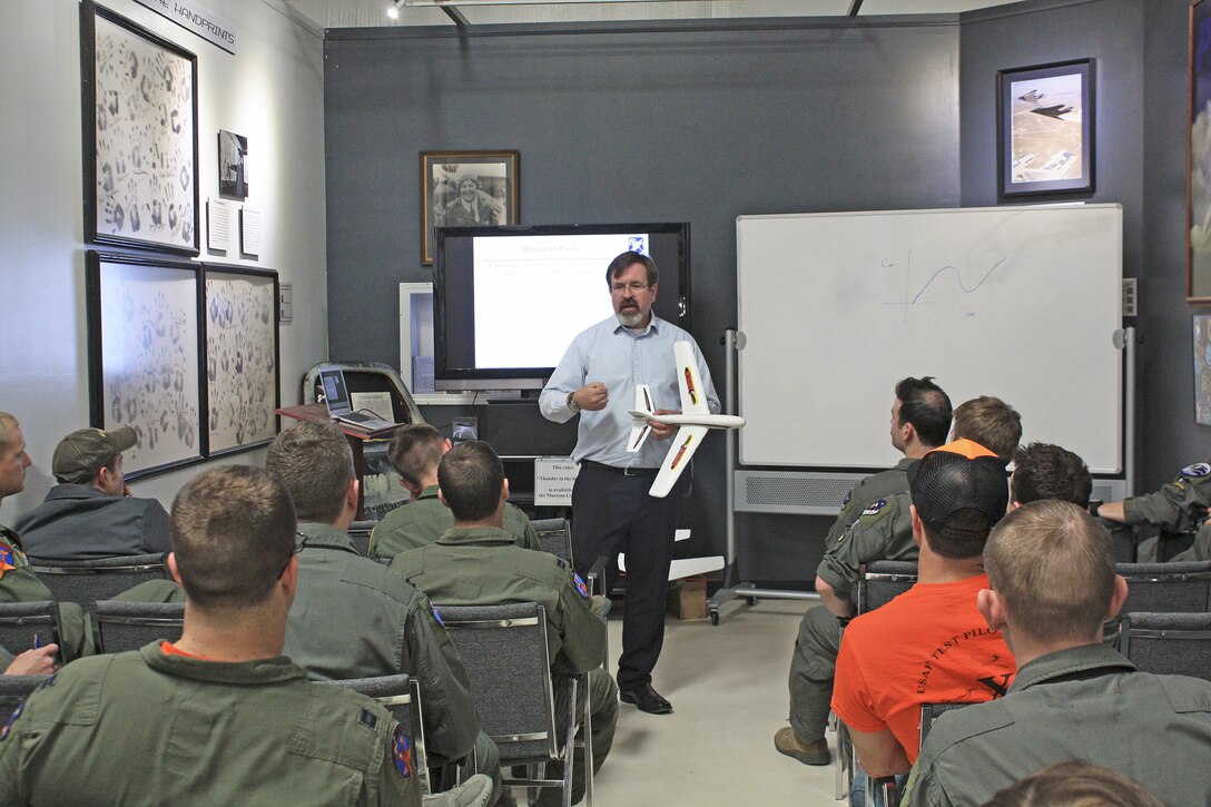 Dr. Chris Cotting, U.S. Air Force Test Pilot School master instructor of flying qualities, teaches a class at the Air Force Flight Test Museum April 4. (U.S. Air Force photo by Stephen K. Robinson)