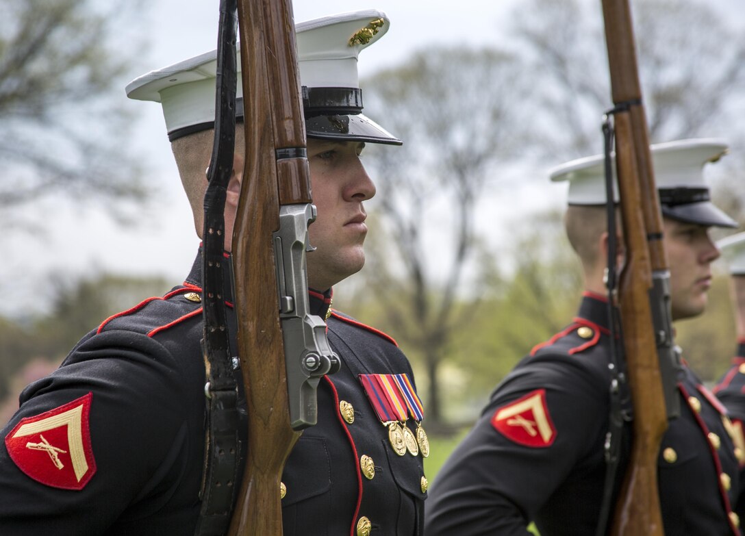 Lance Cpl. Cody McNealy, Marine Corps Silent Drill Platoon, performs during Honor Flight Chicago at the Marine Corps War Memorial, Arlington, Va., Apr. 12, 2017. Each year, veterans of World War II and the Korean War visit Washington, D.C. for a day of honor and rememberance at no cost. (Official Marine Corps photo by Cpl. Robert Knapp/Released)