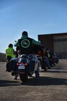 A member of the Green Knights awaits to begin the Thunder on the Bayou ride at Barksdale Air Force Base, La., April 7, 2017. The Green Knights are a military motorcycle club organized to further motorcycle safety and mentorship in the military community. (U.S. Air Force photo/Airman 1st Class Stuart Bright)