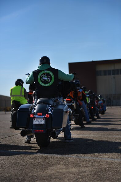 A member of the Green Knights awaits to begin the Thunder on the Bayou ride at Barksdale Air Force Base, La., April 7, 2017. The Green Knights are a military motorcycle club organized to further motorcycle safety and mentorship in the military community. (U.S. Air Force photo/Airman 1st Class Stuart Bright)