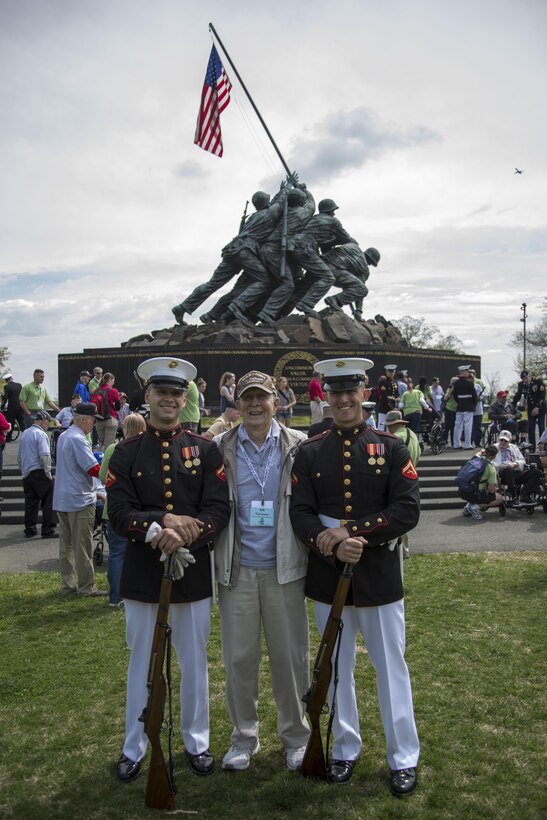 Members of the Marine Corps Silent Drill Platoon meet and greet with veterans of Honor Flight Chicago after their performance at the Marine Corps War Memorial, Arlington, Va., Apr. 12, 2017. Each year, veterans of World War II and the Korean War visit Washington, D.C. for a day of honor and remembrance at no cost. (Official Marine Corps photo by Cpl. Robert Knapp/Released)