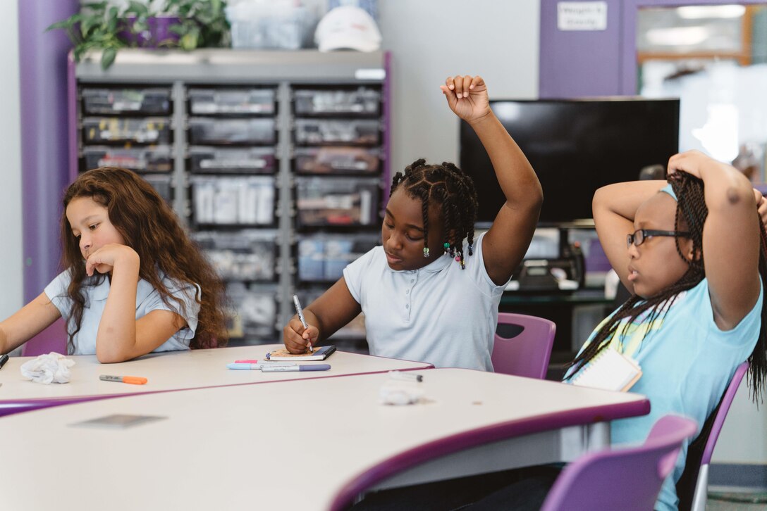 A child raises her hand during a Science, Technology, Engineer and Math Center of Innovation class at Joint Base Andrews, Md., April 5, 2017. The STEM Center of Innovation is one of 22 sponsored facilities world-wide used to inspire children and give youth access to advanced technologies that could inspire them to pursue education in science fields. (U.S. Air Force photo by Senior Airman Delano Scott)
