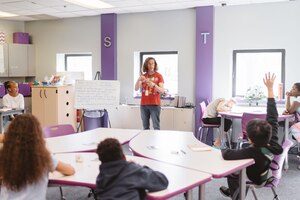 Christine Gramlich, Science, Technology, Engineer and Math Center of Innovation coordinator, teaches students about chemical and physical reactions at Joint Base Andrews, Md., April 5, 2017. The center provides a learning environment to help military children make the most of opportunities in higher education, careers or military service. (U.S. Air Force photo by Senior Airman Delano Scott)