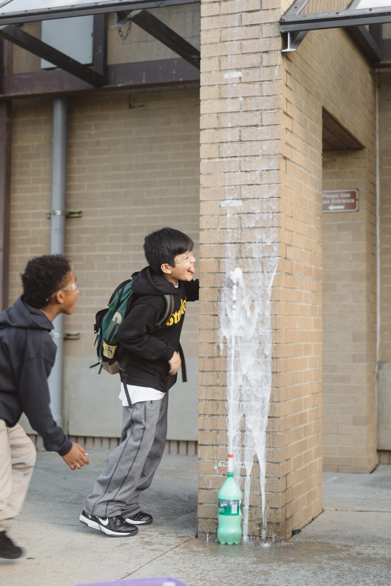 Children observe the reaction between Mentos and soda during a supervised experiment with the Science, Technology, Engineer and Math Center of Innovation Center at Joint Base Andrews, Md., April 5, 2017. The center provides an opportunity for children to explore their interest in science, technology, engineering and math. (U.S. Air Force photo by Senior Airman Delano Scott)  