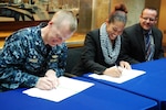 170403-N-VP310-016 PHILADELPHIA (April 3, 2017) - Capt. Francis E. Spencer III, Naval Surface Warfare Center Philadelphia Division (NSWCPD) commanding officer, and Dr. Monique Head, Morgan State University Associate Dean of Research and Graduate Studies, sign an historic, formal Education Partnership Agreement between NSWCPD and Morgan State in Philadelphia April 3, 2017. The partnership will unite Morgan State faculty and students with NSWCPD on U.S. Navy research projects and other Science, Technology, Engineering and Math collaboration efforts. 