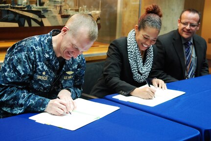 170403-N-VP310-016 PHILADELPHIA (April 3, 2017) - Capt. Francis E. Spencer III, Naval Surface Warfare Center Philadelphia Division (NSWCPD) commanding officer, and Dr. Monique Head, Morgan State University Associate Dean of Research and Graduate Studies, sign an historic, formal Education Partnership Agreement between NSWCPD and Morgan State in Philadelphia April 3, 2017. The partnership will unite Morgan State faculty and students with NSWCPD on U.S. Navy research projects and other Science, Technology, Engineering and Math collaboration efforts. 