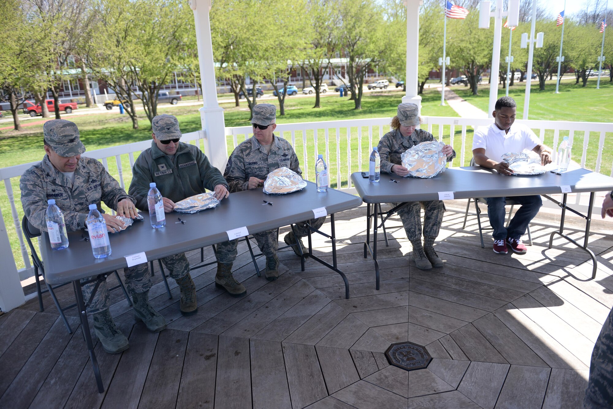 Judges sample four sets of appetizer, entrees and desserts made by four different teams on the parade field at Offutt Air Force Base, Neb., April 6, 2017 during the third annual Offutt Top Chef Grill Masters competition. Each team represented different ranks in the Air Force – junior enlisted, non-commissioned officers, senior non-commissioned officers and officers. (U.S. Air Force photo by Zachary Hada)