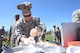 Tech. Sgt. Richard Case, 55th Force Support Squadron Campisi Dining Facility manager, competes in the third annual Offutt Top Chef Grill Masters competition held on the parade field at Offutt Air Force Base, Neb., April 6, 2017. To create their dishes, contestants received three meat, four vegetable, three fruit items and a basket containing three secret ingredients. (U.S. Air Force photo by Zachary Hada)