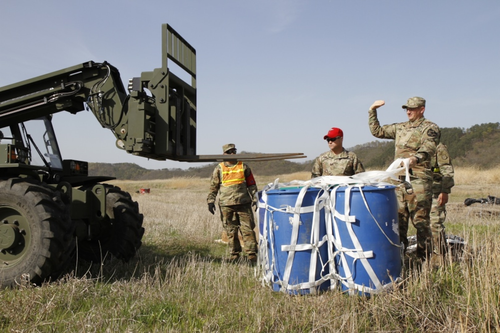 Soldiers from 25th Transportation Battalion, 19th Expeditionary Sustainment Command and 2nd Infantry Division Sustainment Brigade work to recover 55-gallong drums, April 12, 2017, at a drop zone between Daegu and Busan, South Korea. Multiple U.S. assets and ROK Air Force validated their aerial logistics capabilities as part of ongoing exercise Operation Pacific Reach ’17. 