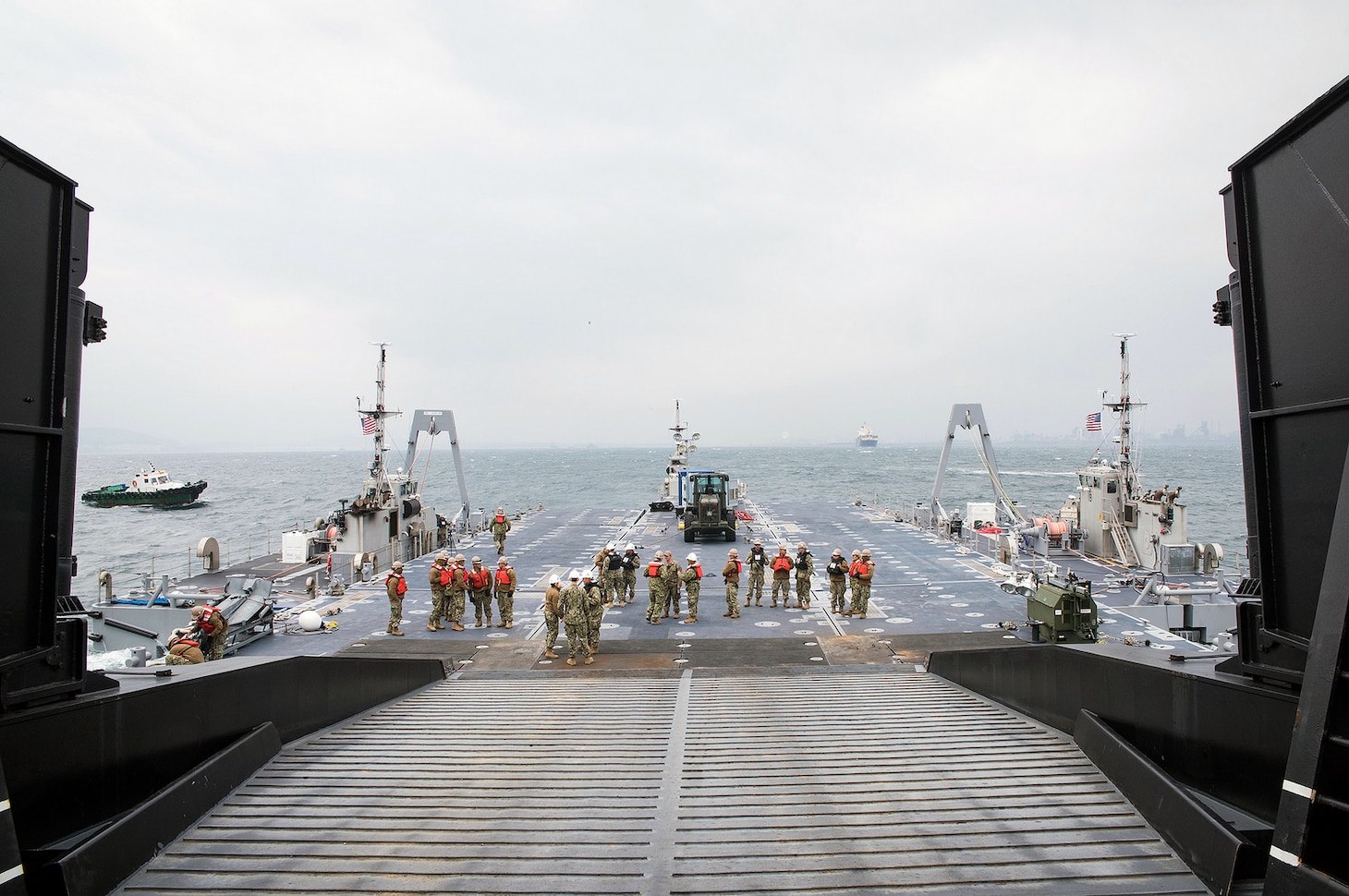 Sailors, attached to Amphibious Construction Battalion 1 and 2, and Assault Craft Unit 1, successfully secure the Improved Navy Lighterage System Roll-on/Roll-off Discharge Facility to the ramp of USNS Pililaau (T-AKR 304) during Operation Pacific Reach Exercise 2017 (OPRex17), April 9, 2017. OPRex17 is a bilateral training event designed to ensure readiness and sustain the Republic of Korea-U.S. Alliance by exercising an Area Distribution Center (ADC), an Air Terminal Supply Point (ATSP), Combined Joint Logistics Over-the-Shore (CLOTS), and the use of rail, inland waterways, and coastal lift operations to validate the operational reach concept.