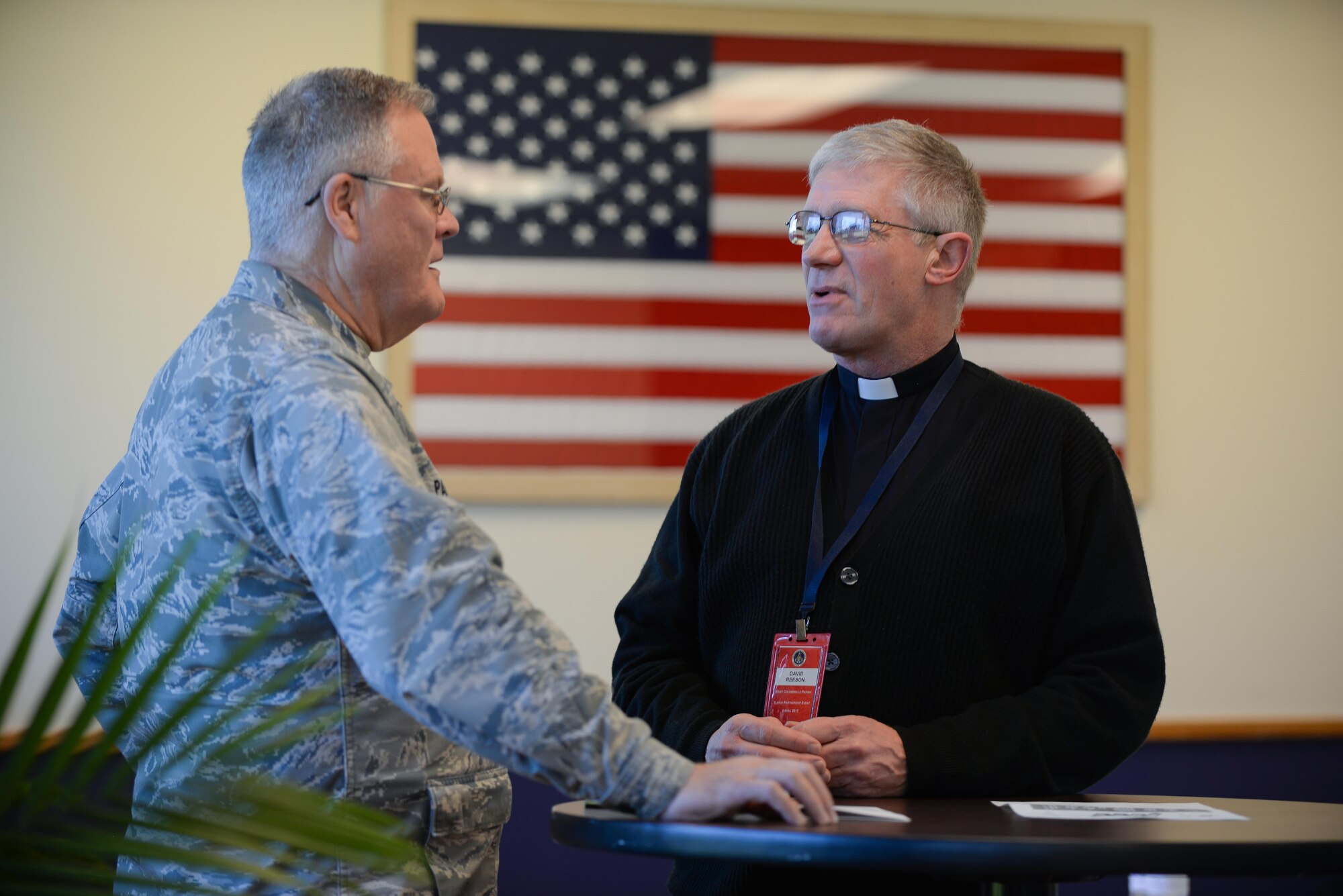 Chaplain (Lt. Col.) James Parrish, 55th Wing Chaplain, and David Reeson, Saint Columbkill Parish pastor, discuss religious matters during the 2017 Clergy Partnership Event at the Capehart Chapel here April 6. More than 20 religious leaders from denominations from across the Omaha metro attended this event.  (U.S. Air Force photo by Zachary Hada)