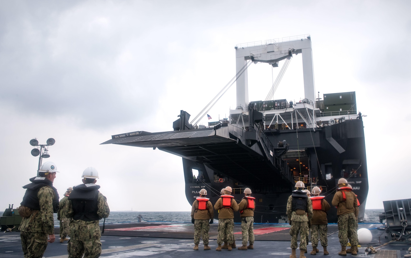 Sailors, attached to Amphibious Construction Battalion 1 and 2, work on connecting Improved Navy Lighterage System Roll-on/Roll-off Discharge Facility to the ramp of USNS Pililaau (T-AKR 304) during Operation Pacific Reach Exercise 2017 (OPRex17), April 9, 2017. OPRex17 is a bilateral training event designed to ensure readiness and sustain the ROK-U.S. Alliance by exercising an Area Distribution Center (ADC), an Air Terminal Supply Point (ATSP), Combined Joint Logistics Over-the-Shore (CLOTS), and the use of rail, inland waterways, and coastal lift operations to validate the operational reach concept. 