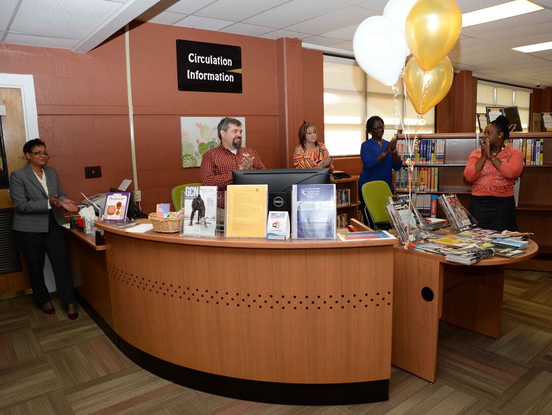 Library supporters and patrons celebrate the Grand Re-Opening of the newly-renovated Base Library and National Library Week at Marine Corps Logistics Base Albany, April 12. Lt. Col. Nathaniel Robinson, executive officer, MCLB Albany, read and signed the proclamation at the event.
