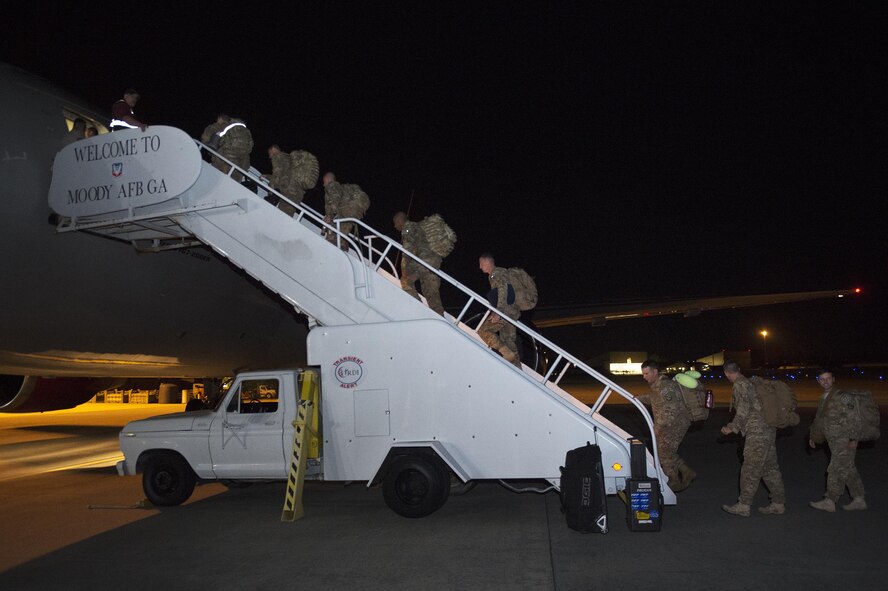 Members of the 824th Base Defense Squadron board an aircraft prior to deploying, April 12, 2017, at Moody Air Force Base, Ga. More than 100 Airmen from the 824th BDS, known as the ‘Ghostwalkers,’deployed to Southwest Asia to provide fully-integrated, highly capable and responsive forces while safeguarding Expeditionary Air Force assets. (U.S. Air Force photo by Airman 1st Class Greg Nash)