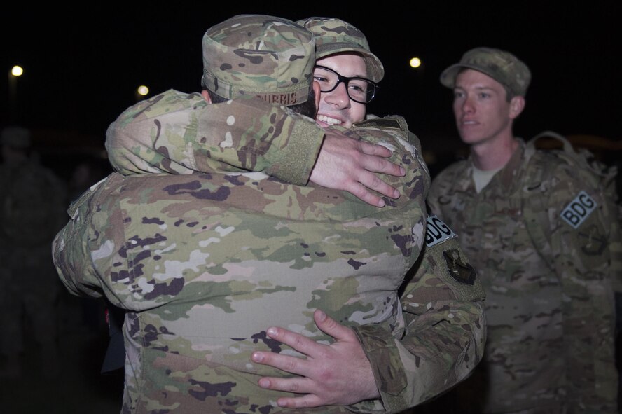 Senior Airman Erik Hjelden, 824th Base Defense Squadron fireteam member, embraces fellow 824th BDS member, Tech. Sgt. Chris Burris, prior to deploying, April 11, 2017, at Moody Air Force Base, Ga. More than 100 Airmen from the 824th BDS, known as the ‘Ghostwalkers,’deployed to Southwest Asia to provide fully-integrated, highly capable and responsive forces while safeguarding Expeditionary Air Force assets. (U.S. Air Force photo by Airman 1st Class Greg Nash)