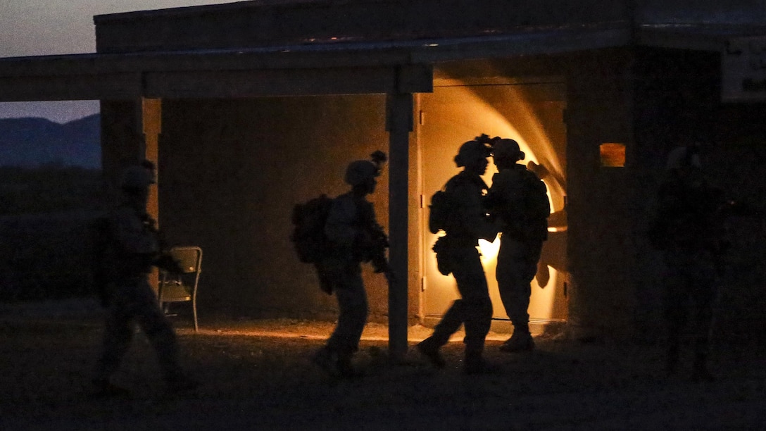 Marines conduct drills to clear rooms during a raid as part of a weapons and tactics course at Yuma Proving Ground, Ariz., April 12, 2017. The Marines are assigned to 2nd Battalion, 6th Marine Regiment. The exercise focused on executing an air assault raid supported by aircraft escorts. Marine Corps photo by Staff Sgt. Artur Shvartsberg