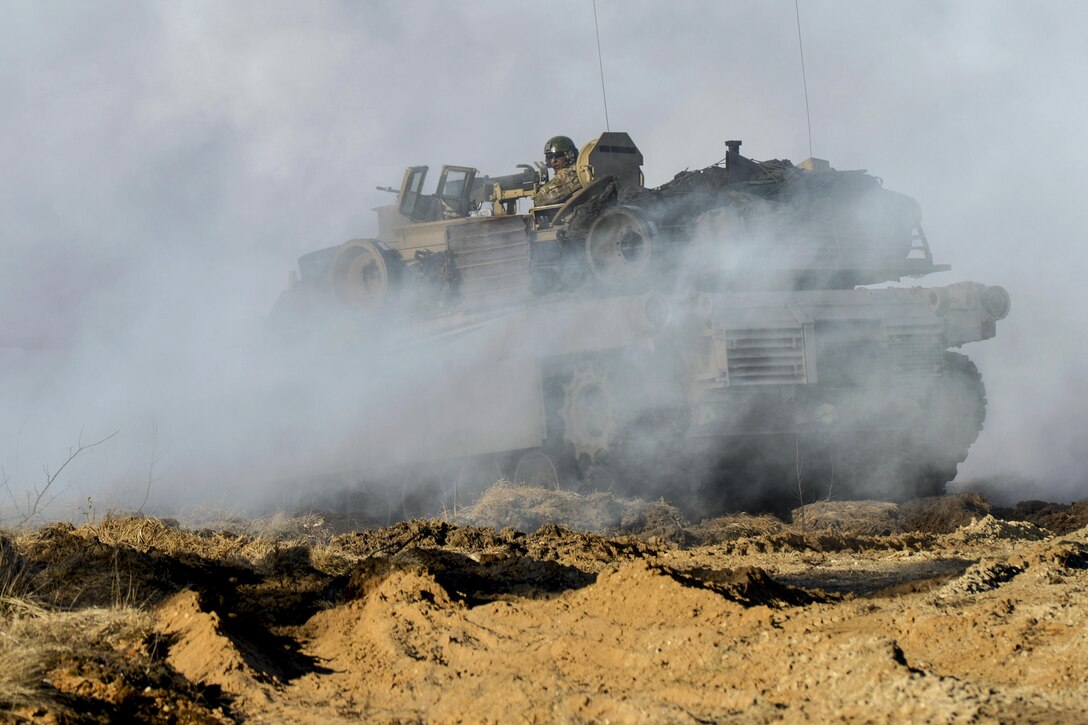 Estonian and U.S. soldiers train during a combat exercise at the Estonian Central Training Area near Tapa, Estonia, April 6, 2017. The U.S. soldiers, assigned to Company C, 1st Battalion, 68th Armor Regiment, participated to boost the capabilities of the Estonian forces under the NATO-led Operation Atlantic Resolve. Army photo by Jason Johnston