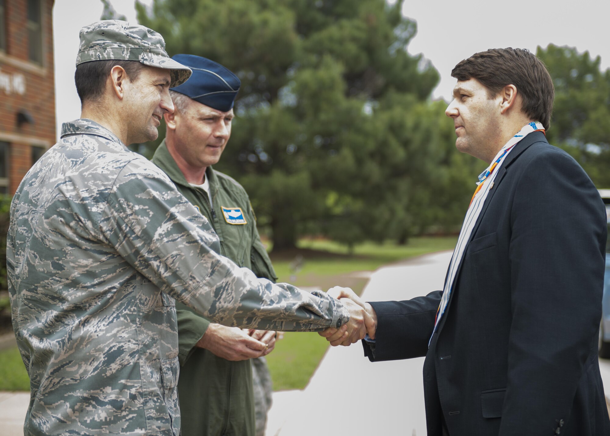 U.S. Rep. Jodey Arrington, R-TX, bids farewell to senior Dyess leaders April 12, 2017, at Dyess Air Force Base, Texas. Upon his departure, the congressman was given a flight streamer, coin and unit patch from the 7th Bomb Wing and 317th Airlift Group. (U.S. Air Force photo by Airman 1st Class Katherine Miller)