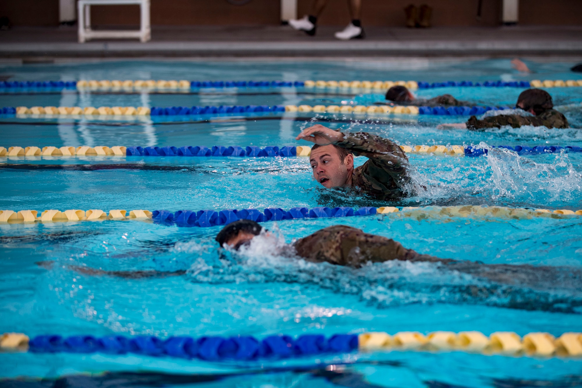 U.S. Air Force Tech. Sgt. Jason Grey, 19th Air support Operations Squadron intelligence surveillance and reconnaissance liaison officer swims during a German armed forces proficiency assessment, April 5, 2017, at Fort Campbell, Ky. To enhance their ability to work together in deployed locations, members of the German Air Force travelled to Fort Campbell to train and exercise with the 19th ASOS. While at Fort Campbell, The German Air Force members hosted a German armed forces proficiency assessment for Airmen consisting of shooting firearms, swimming, agility exercises and a rucksack march.