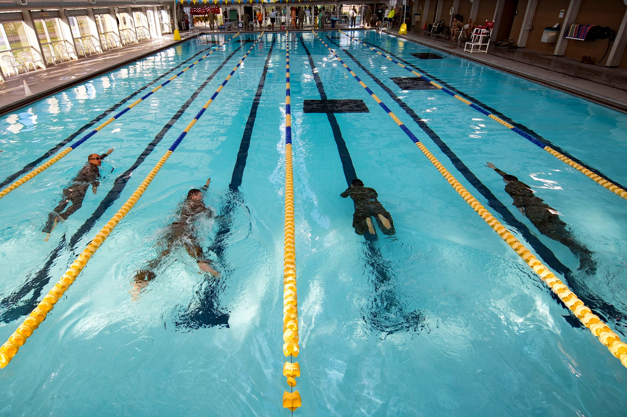 U.S. Air Force Airmen from the 19th Air Support Operations Squadron swim during a German armed forces proficiency assessment, April 5, 2017, at Fort Campbell, Ky. To enhance their ability to work together in deployed locations, members of the German Air Force travelled to Fort Campbell to train and exercise with the 19th ASOS. While at Fort Campbell, The German Air Force members hosted a German armed forces proficiency assessment for Airmen consisting of shooting firearms, swimming, agility exercises and a rucksack march.