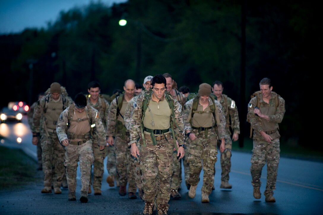 U.S. Air Force Airmen from the 19th Air Support Operations Squadron begin a rucksack march during a German armed forces proficiency assessment, April 6, 2017, at Fort Campbell, Ky. To enhance their ability to work together in deployed locations, members of the German Air Force travelled to Fort Campbell to train and exercise with the 19th ASOS. While at Fort Campbell, The German Air Force members hosted a German armed forces proficiency assessment for Airmen consisting of shooting firearms, swimming, agility exercises and a rucksack march.