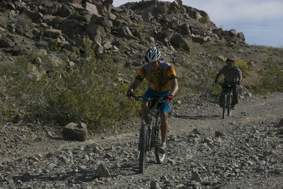 Lt. Col. Timothy Pochop, director, Natural Resources and Environmental Affairs division, finishes the annual Earth Day Bike ride held aboard Marine Corps Air Ground Combat Center, Twentynine Palms, Calif., April 8, 2017. The 11-mile ride started at Range 100. (U.S. Marine Corps photo by Lance Cpl. Dave Flores)