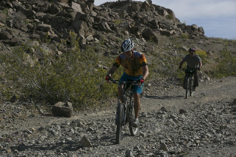 Lt. Col. Timothy Pochop, director, Natural Resources and Environmental Affairs division, finishes the annual Earth Day Bike ride held aboard Marine Corps Air Ground Combat Center, Twentynine Palms, Calif., April 8, 2017. The 11-mile ride started at Range 100. (U.S. Marine Corps photo by Lance Cpl. Dave Flores)