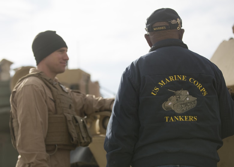 Retired U.S. Marine Corps Staff Sgt. Kenneth R. White talks to a Marine with 4th Tank Battalion at Range 500 during a visit to Marine Corps Air Ground Combat Center, Twentynine Palms, Calif., Sunday. 4th Tanks invited White aboard the Combat Center because they wanted to honor his last wish as a former tanker. (U.S. Marine photo by Lance Cpl. Natalia Cuevas)