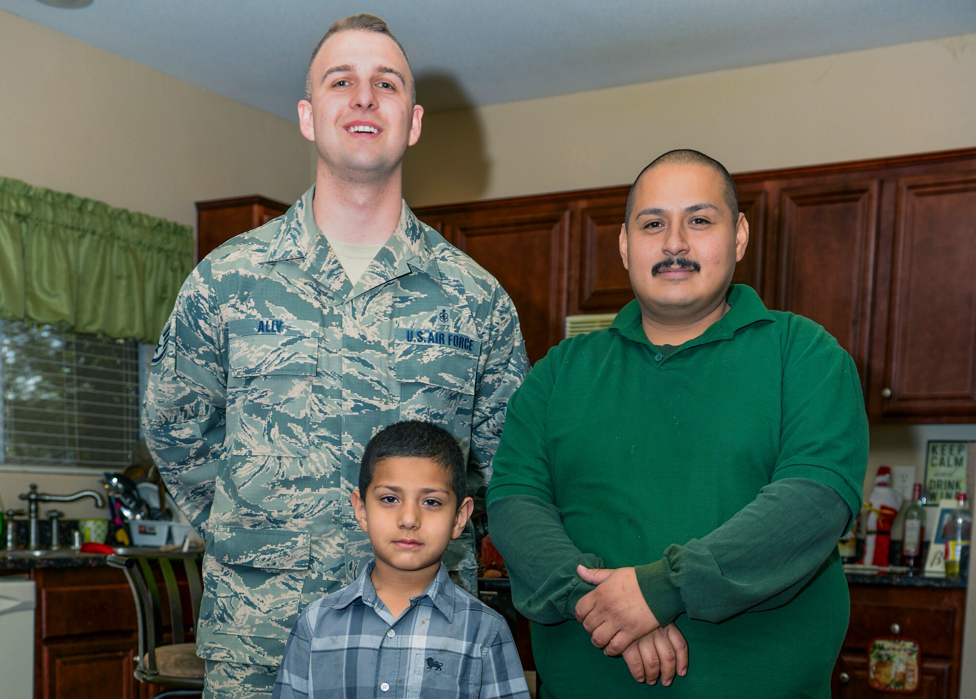Staff Sgt. Jeffry Ally, 99th Medical Group surgical technician, right, Juan Sanjuan, Ally’s neighbor, and his son, Chava, pose for a photo in Las Vegas, Nev., April 4, 2017. Ally saved the child’s life when Sanjuan ran to him for help. His trauma and CPR experience allowed him to properly expel food that was obstructing the child’s airways. (U.S. Air Force photo by Airman 1st Class Andrew Sarver/Released)