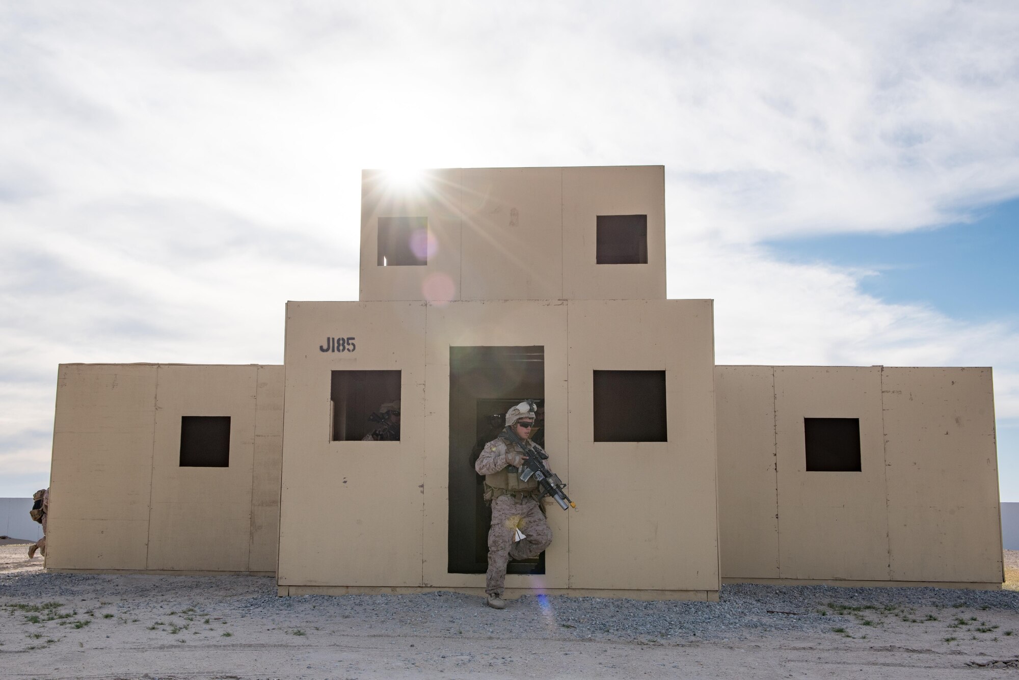 A U.S. Marine assigned to 1st Battalion, 7th Marine Regiment, Special Purpose Marine Air-Ground Task Force-Crisis Response-Central Command posts as security during a tactical recovery of aircraft and personnel exercise at an undisclosed location in Southwest Asia, April 5, 2017.  Marines with 1/7 compose the ground combat element, to include the dedicated TRAP force, for SPMAGTF-CR-CC within the USCENTCOM area of operations, spanning 20 countries. SPMAGTF-CR-CC is currently forward deployed to several host nations, with the ability to respond to a variety of contingencies rapidly and effectively.(U.S. Air Force photo/Master Sgt. Benjamin Wilson)(Released)