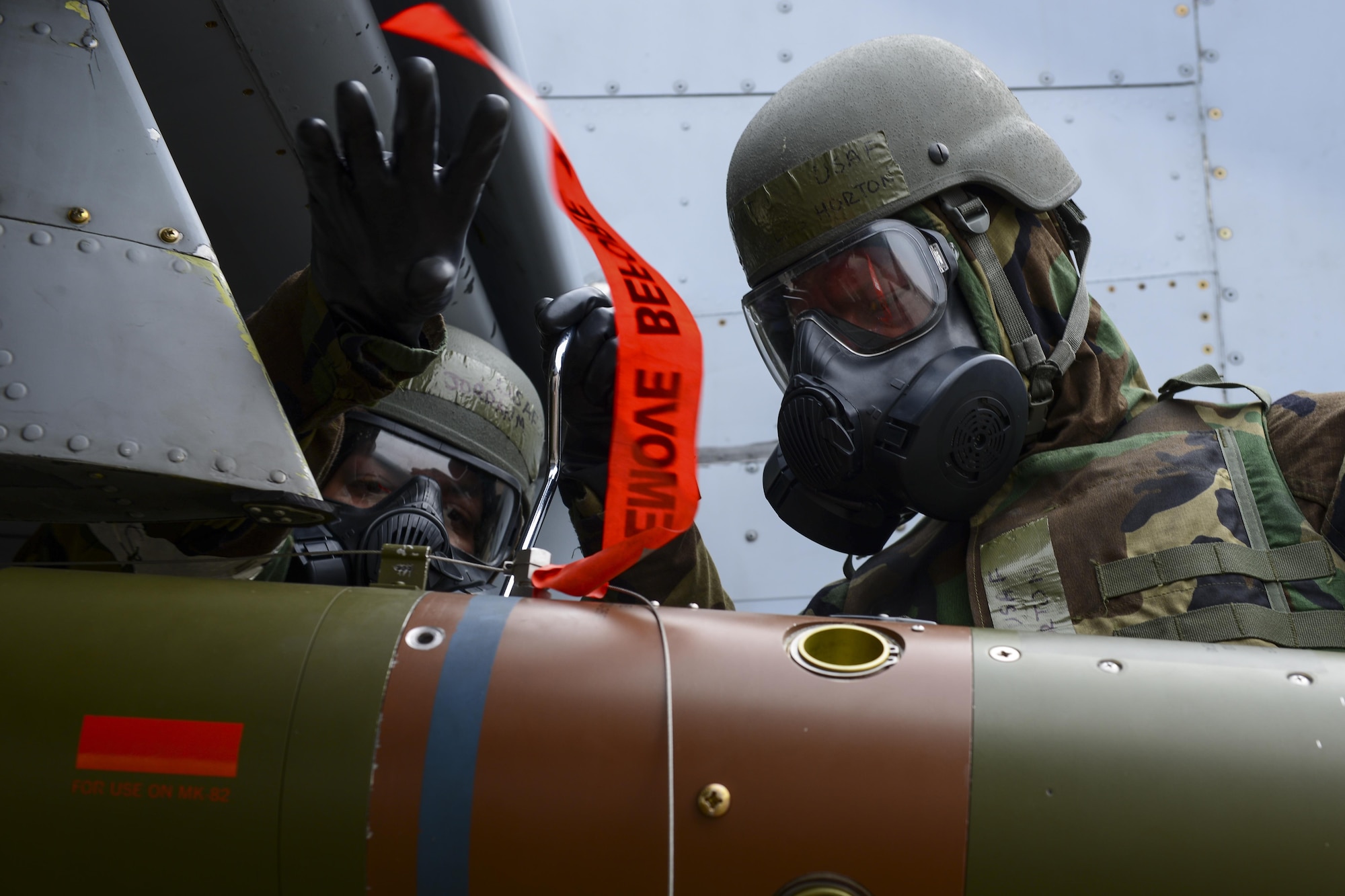 U.S. Air Force Senior Airman Jordan Palomo, left, and U.S. Air Force Staff Sgt. Charles Horton, 25th Aircraft Maintenance Unit weapons load crew members, secure a GBU-12 Paveway II to an A-10 Thunderbolt II during the 51st Maintenance Group’s quarterly weapons load crew competition at Osan Air Base, Republic of Korea, April 14, 2017. The top weapons load crew from the 25th and 36th AMUs and the New Jersey Air National Guard’s 177th Aircraft Maintenance Squadron competed to see who could arm their respective aircraft the quickest, most efficient and safest. (U.S. Air Force photo by Staff Sgt. Victor J. Caputo)