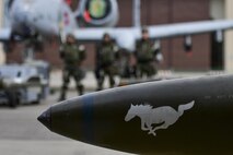 A 25th Aircraft Maintenance Unit weapons load crew waits near their aircraft before the quarterly 51st Maintenance Group weapons load crew competition at Osan Air Base, Republic of Korea, April 14, 2017. The top weapons load crew from the two AMUs compete every quarter for the number one spot, and this quarter were joined by a New Jersey Air National Guard 177th Aircraft Maintenance Squadron crew. (U.S. Air Force photo by Staff Sgt. Victor J. Caputo)