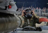 U.S. Air Force Senior Airman Aaron McBride, 36th Aircraft Maintenance Squadron 3-man, loads a GBU-12 Paveway II onto an F-16 Flying Falcon during a quarterly 51st Maintenance Group weapons load competition at Osan Air Base, Republic of Korea, April 14, 2017. The GBU-12 is an American aerial laser guided bomb and is considered a general-purpose warhead. (U.S. Air Force photo by Airman 1st Class Gwendalyn Smith)