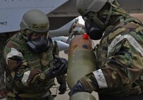 U.S. Air Force Senior Airman Jordan Palomo, 25th Aircraft Maintenance Unit 3-man ,left, and U.S. Air Force Staff Sgt. Charles Horton 25th AMU 1-man ,right, loads a GBU-12 Paveway II missile onto an A-10 Thunderbolt II during a quarterly 51st Maintenance Group weapons load competition at Osan Air Base, Republic of Korea, April 14, 2017. Each team was responsible for loading an AIM-9 Sidewinder, GBU-38 Joint Direct Attack Munition, and GBU-12 Paveway II onto an aircraft frame in a timely manner. (U.S. Air Force photo by Airman 1st Class Gwendalyn Smith)