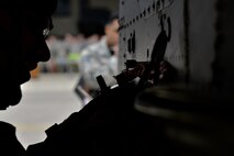 U.S. Air Force Senior Airman Cesar Otero-Moya, 25th Aircraft Maintenance Unit 2-man, tightens a GBU-12 Paveway II during a quarterly 51st Maintenance Group weapons load competition at Osan Air Base, Republic of Korea, April 14, 2017. The GBU-12 Paveway II is an American aerial laser guided bomb and is considered a general-purpose warhead. (U.S. Air Force photo by Airman 1st Class Gwendalyn Smith)